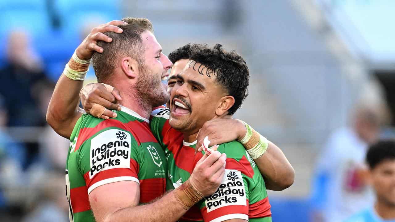 Thomas Burgess and Latrell Mitchell celebrate in an NRL game.