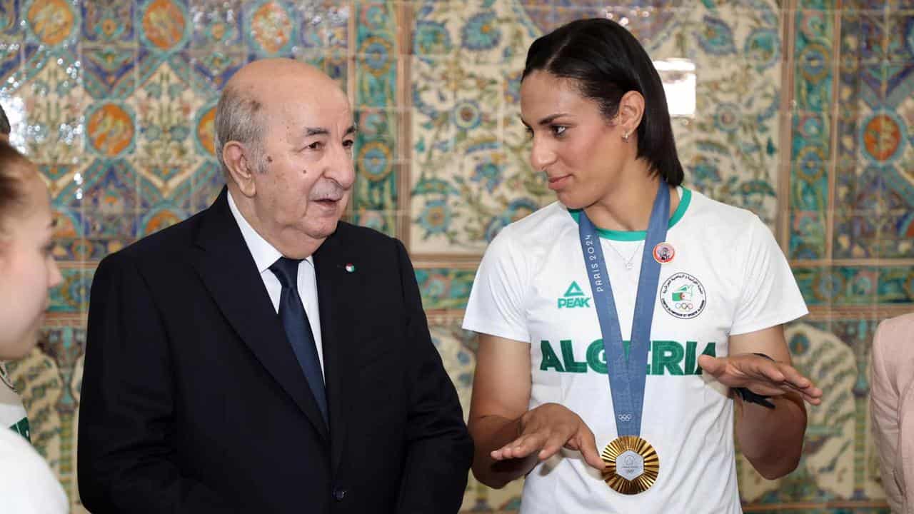 Algerian president speaking with Imane Khelif.