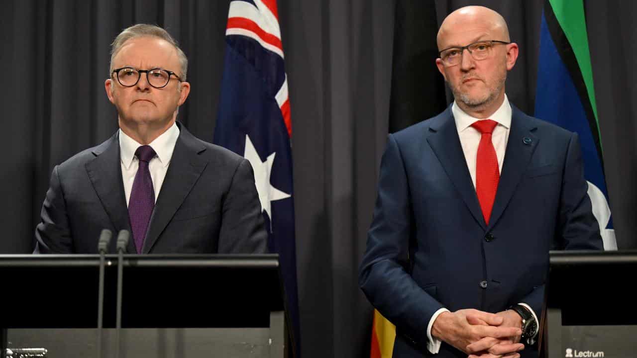 Two men at a press conference.