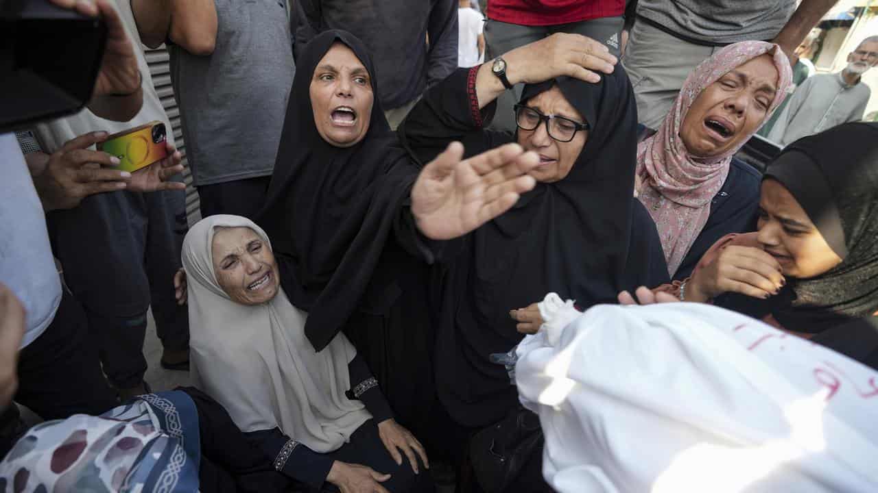 Palestinians mourn relatives killed in the Israeli bombardment of Gaza