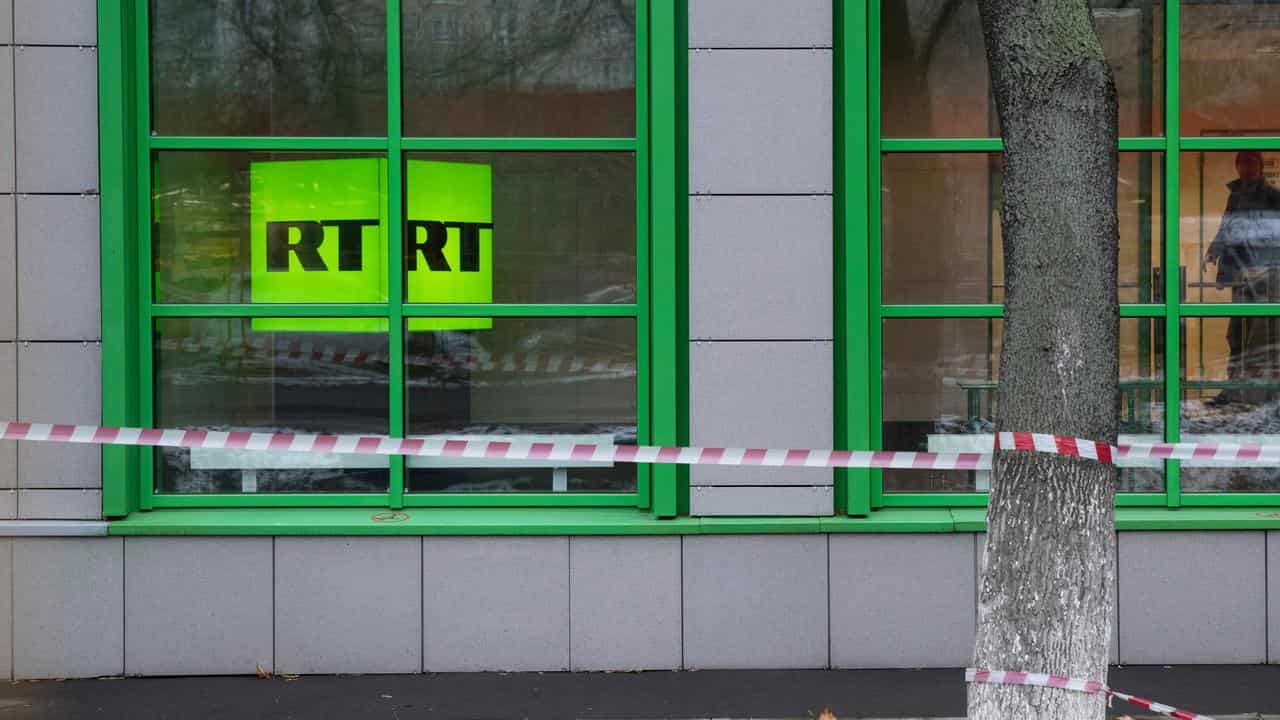 RT logo at the window of the company's office in Moscow, Russia