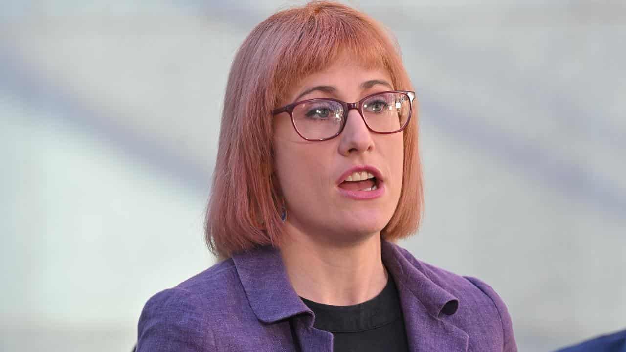 A woman at a press conference.