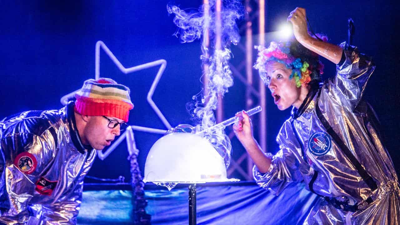 Performers Kurt Murray and Iulia Benze create bubbles