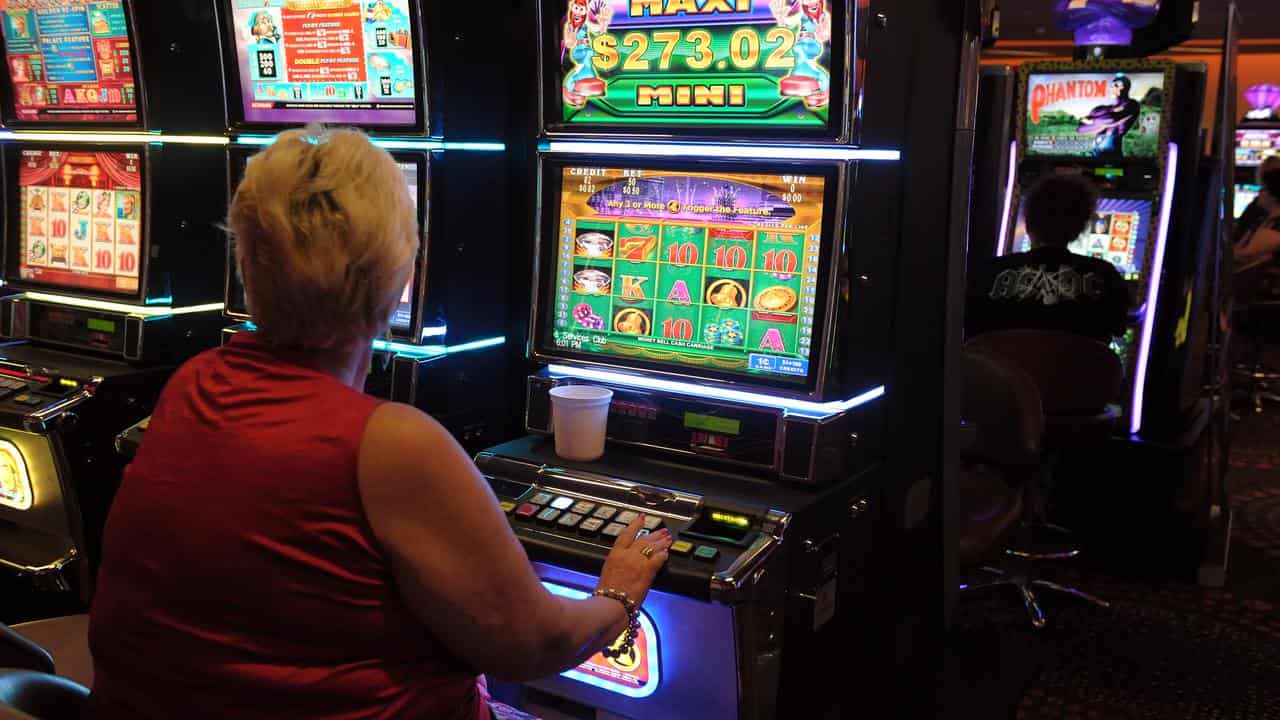 Woman playing pokies