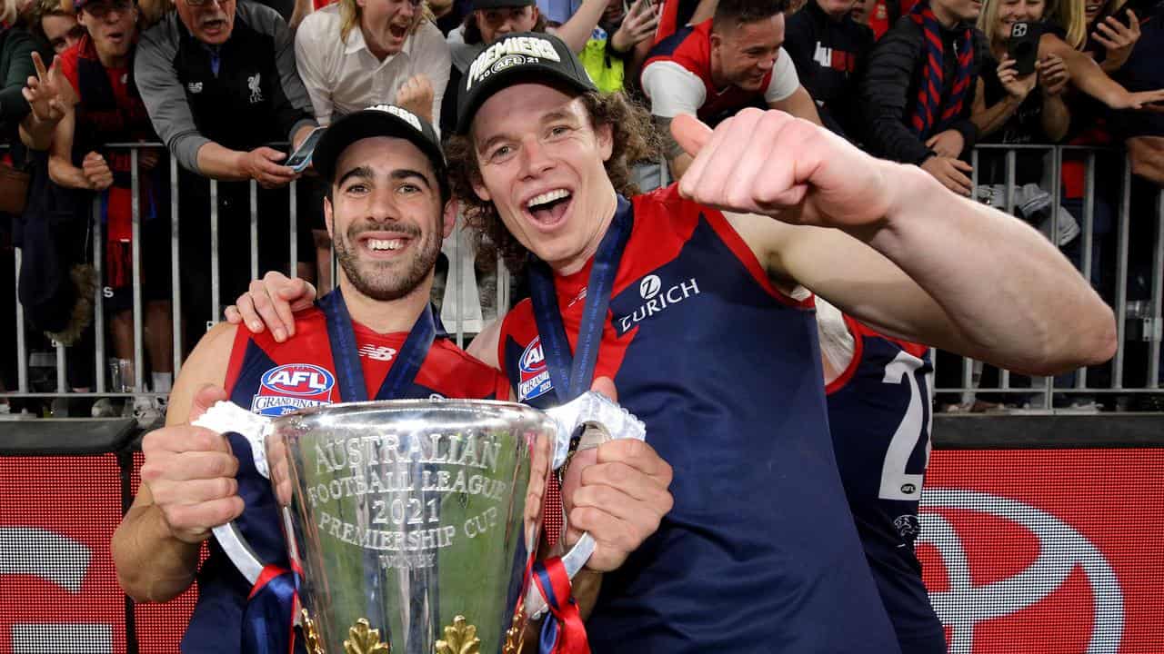 Christian Petracca and Ben Brown with the premiership cup.