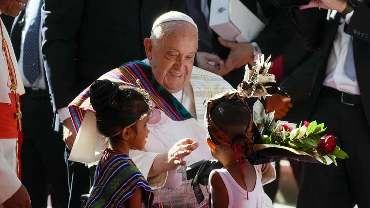 Pope Francis meets girls at the Irmas Alma school in Dili, East Timor