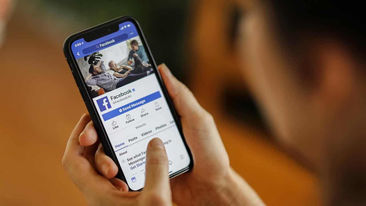 A phone displaying the Facebook app (file image)