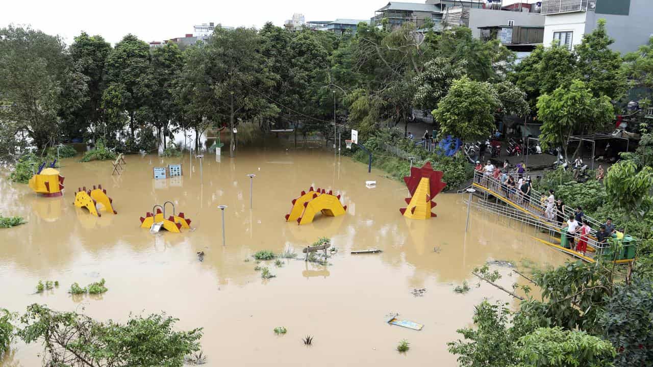 A submerged dragon structure at a playground in Hanoi, Vietnam