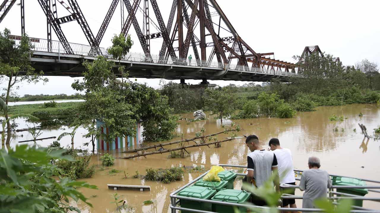 The flooded Red river next to Long Bien bridge in Hanoi, Vietnam