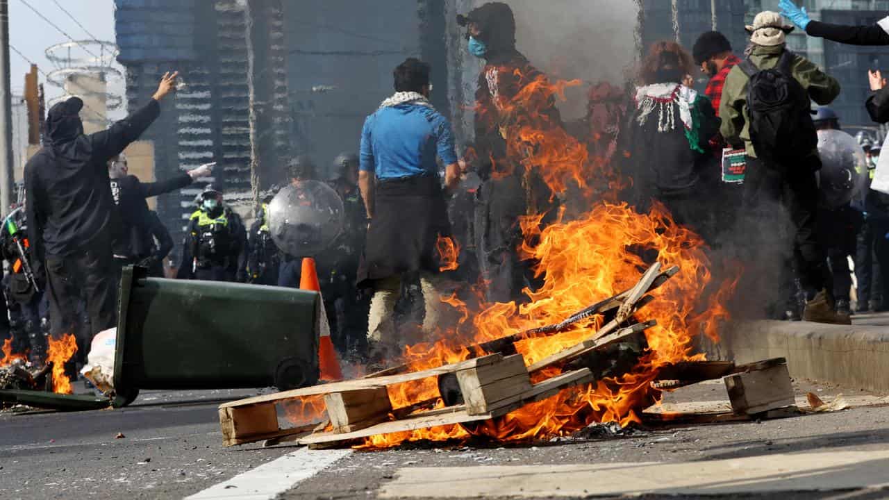 On Wednesday, protesters set wooden pallets on fire