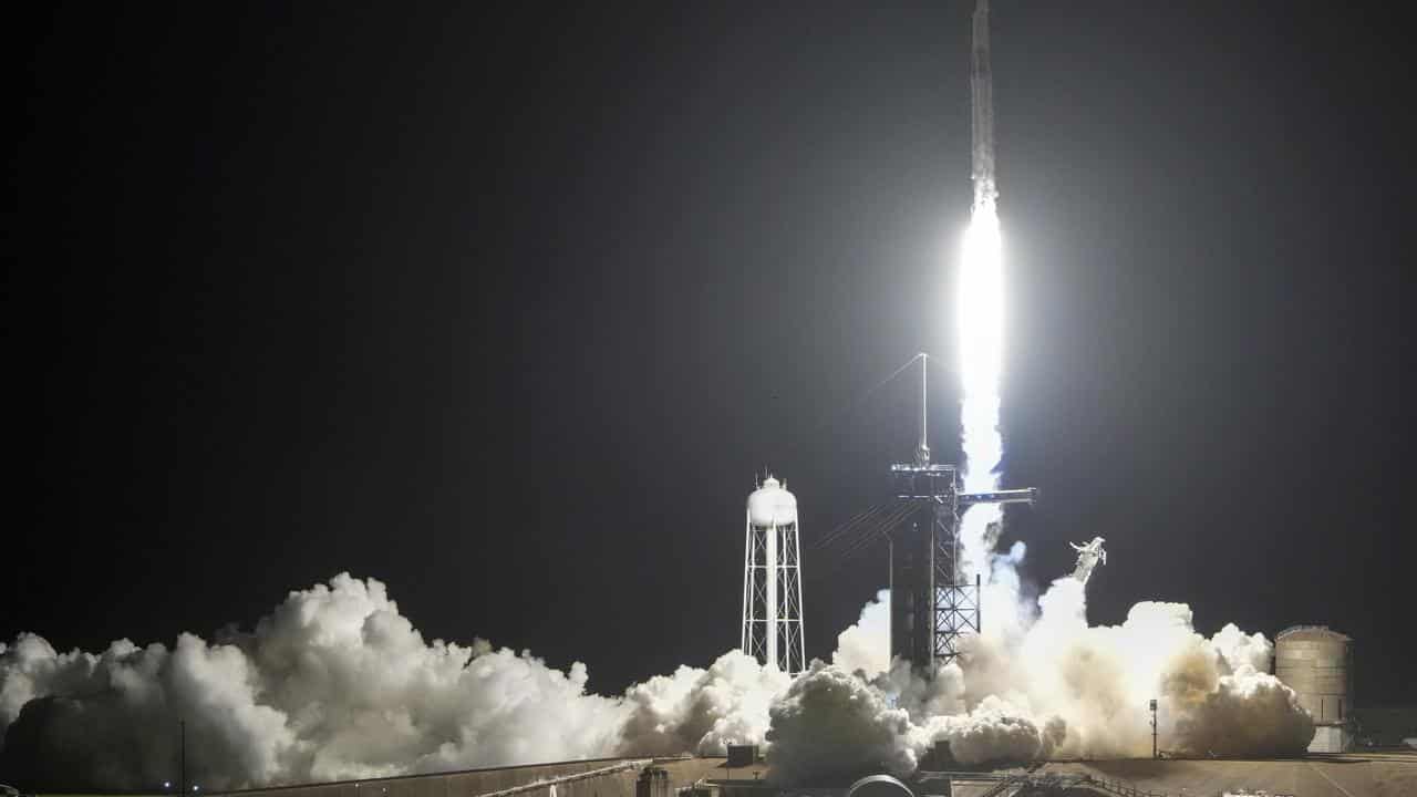 A SpaceX Falcon 9 rocket lifts off at the Kennedy Space Center