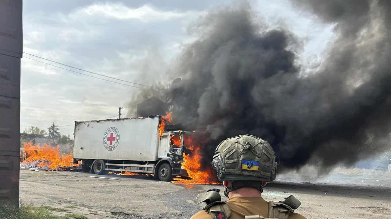 Red Cross trucks on fire