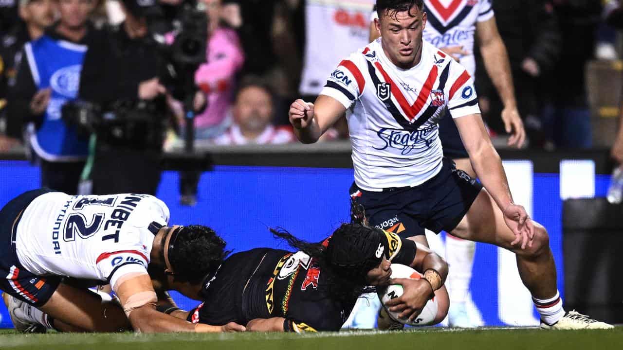 Jarome Luai of the Panthers scores a try.