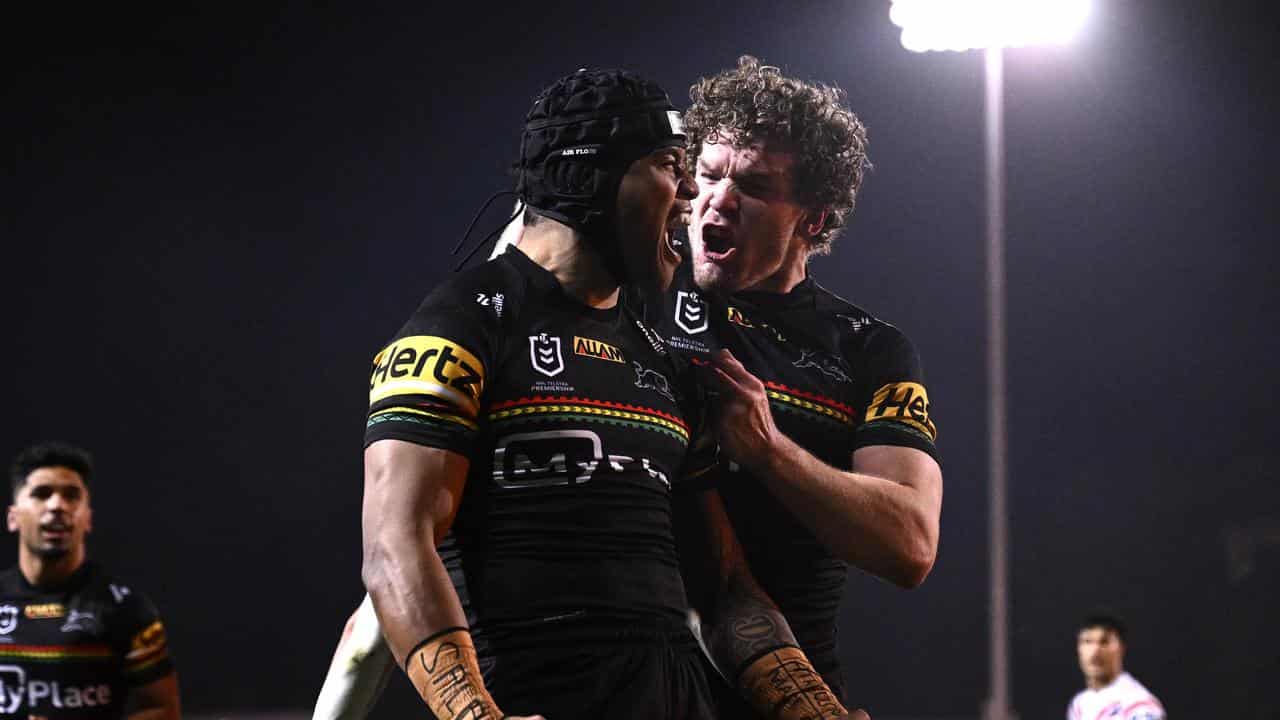 Brian To'o of the Panthers (left) celebrates with Liam Martin.