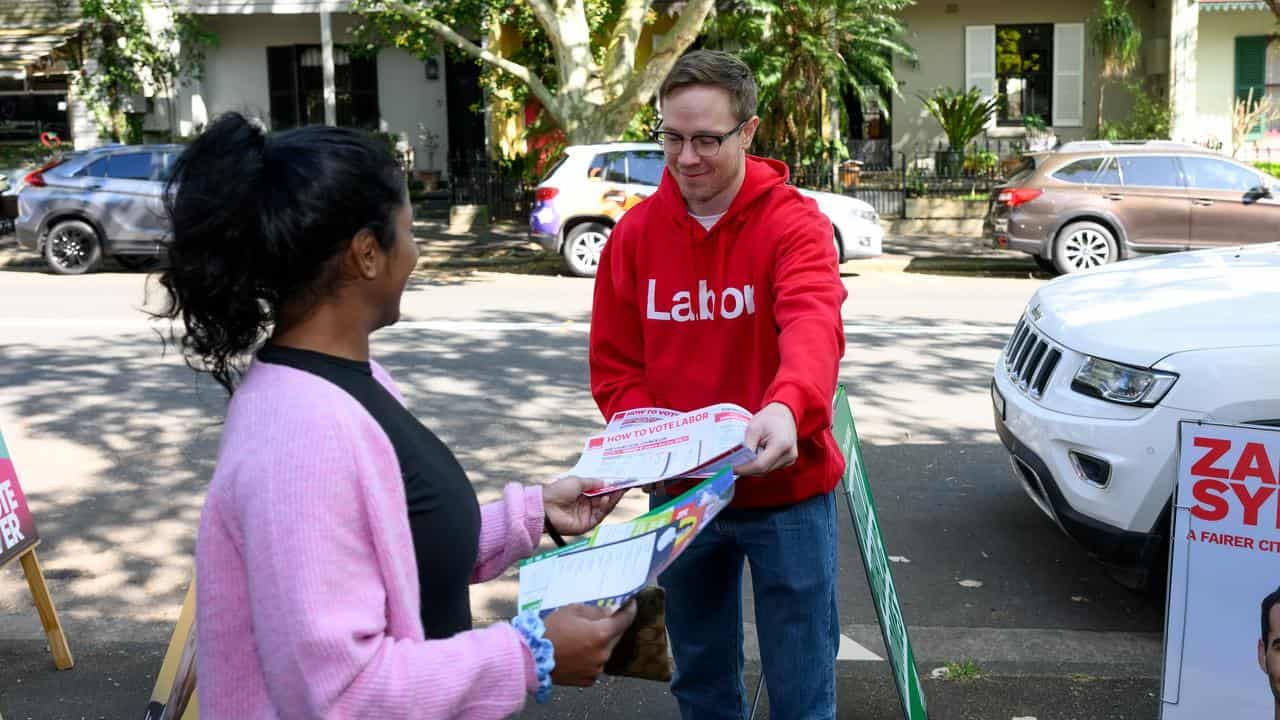 Volunteers handing out voting instructions in Redfern