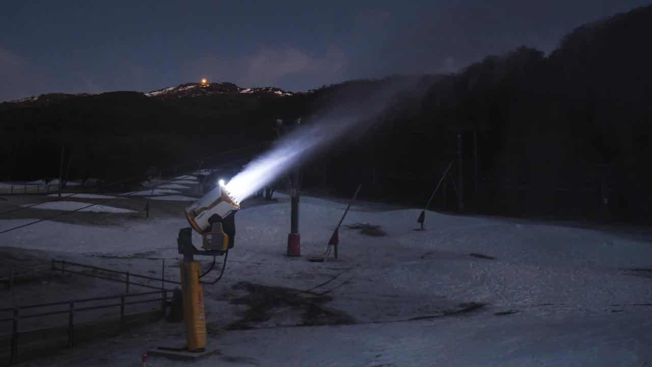 Snow guns running during sunrise at Thredbo