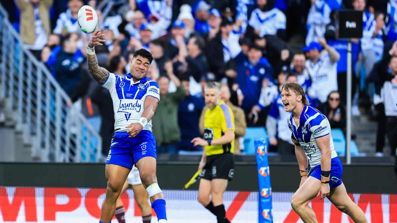 Canterbury's Jeral Skelton (left) celebrates scoring a try.