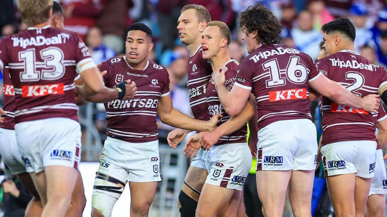 Happy Manly players.