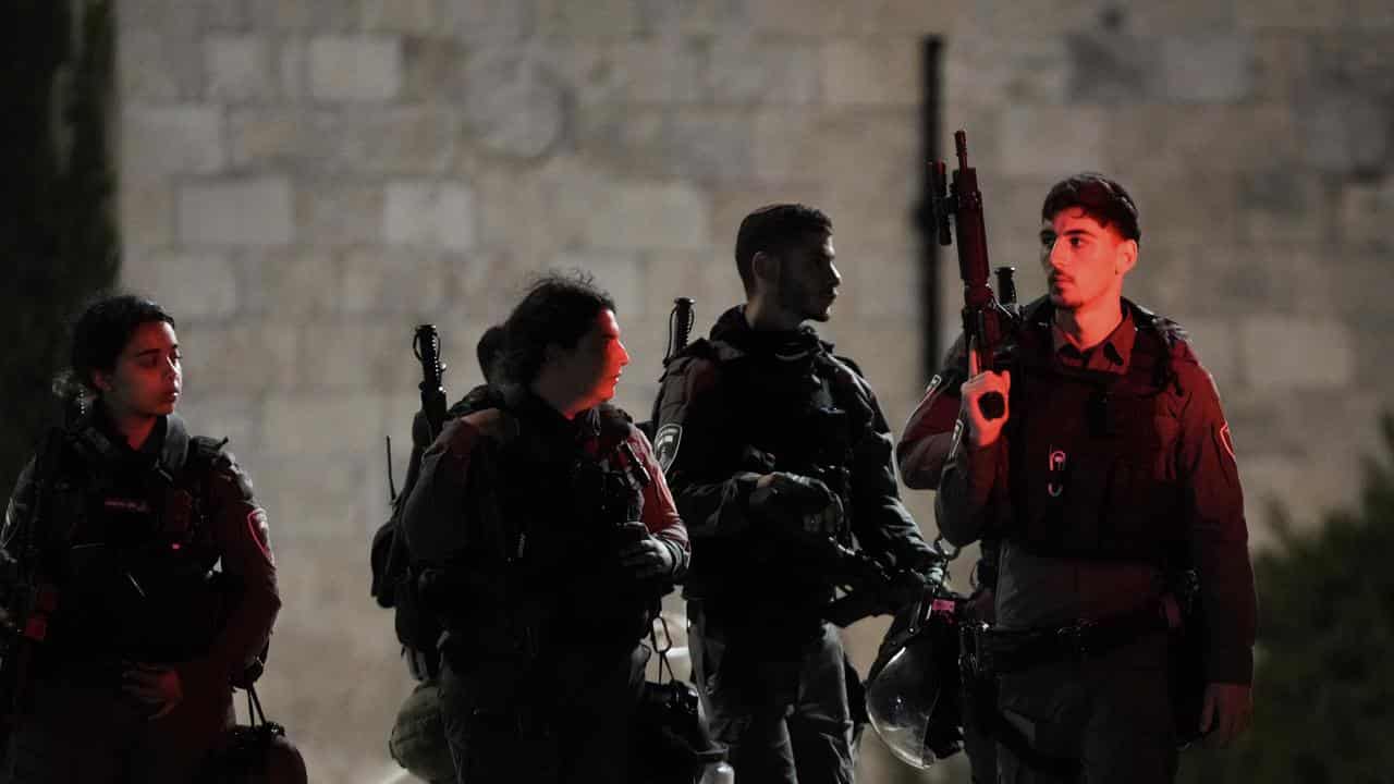 Israeli border police officers stand guard