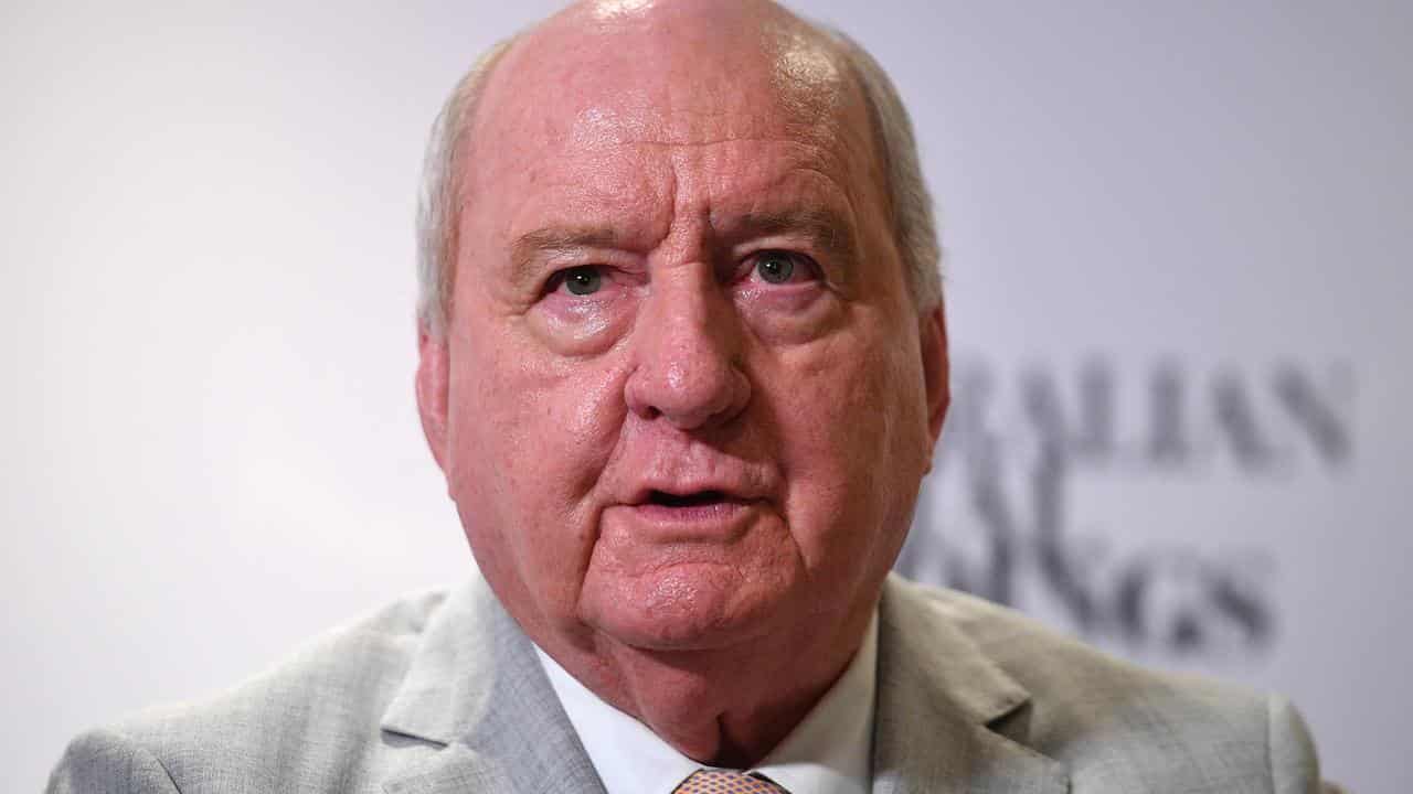 Alan Jones speaks to journalists in Sydney in December 2021.