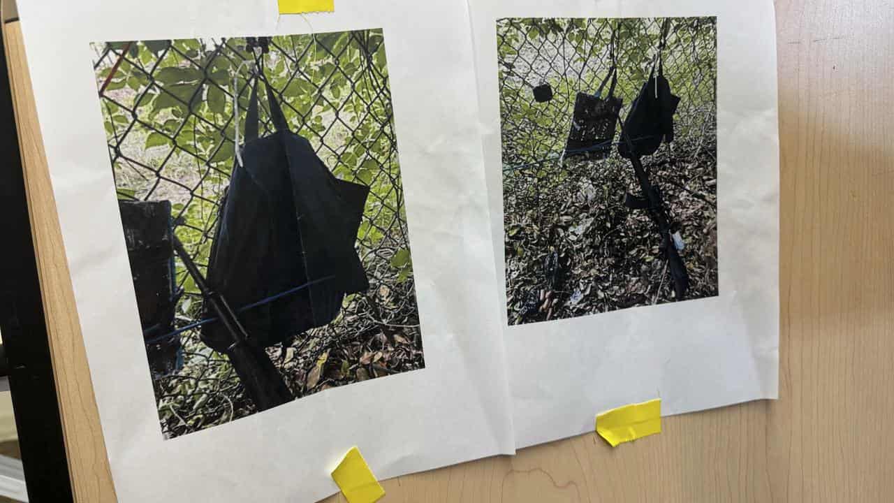 Photos of a backpack and rifle left at the scene