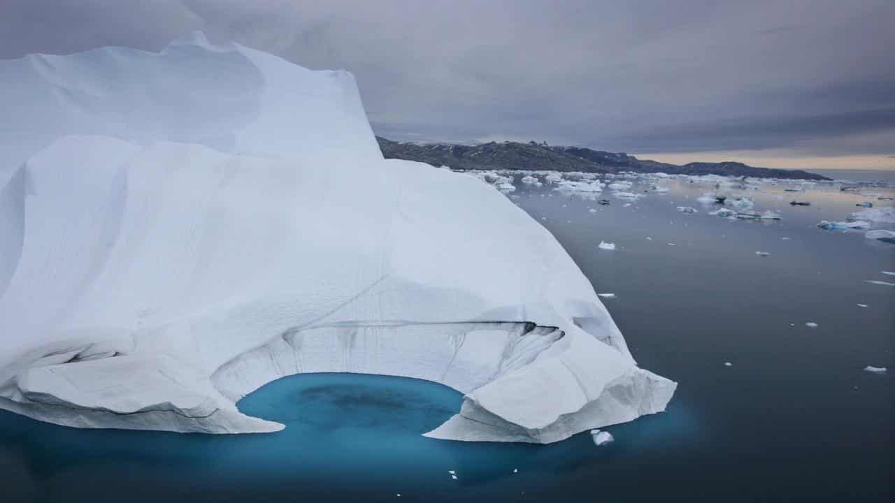 An iceberg is seen melting off the coast of Ammasalik, Greenland.