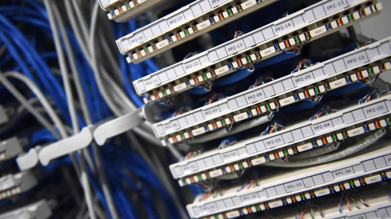 Ethernet data cables are seen in a server room  in