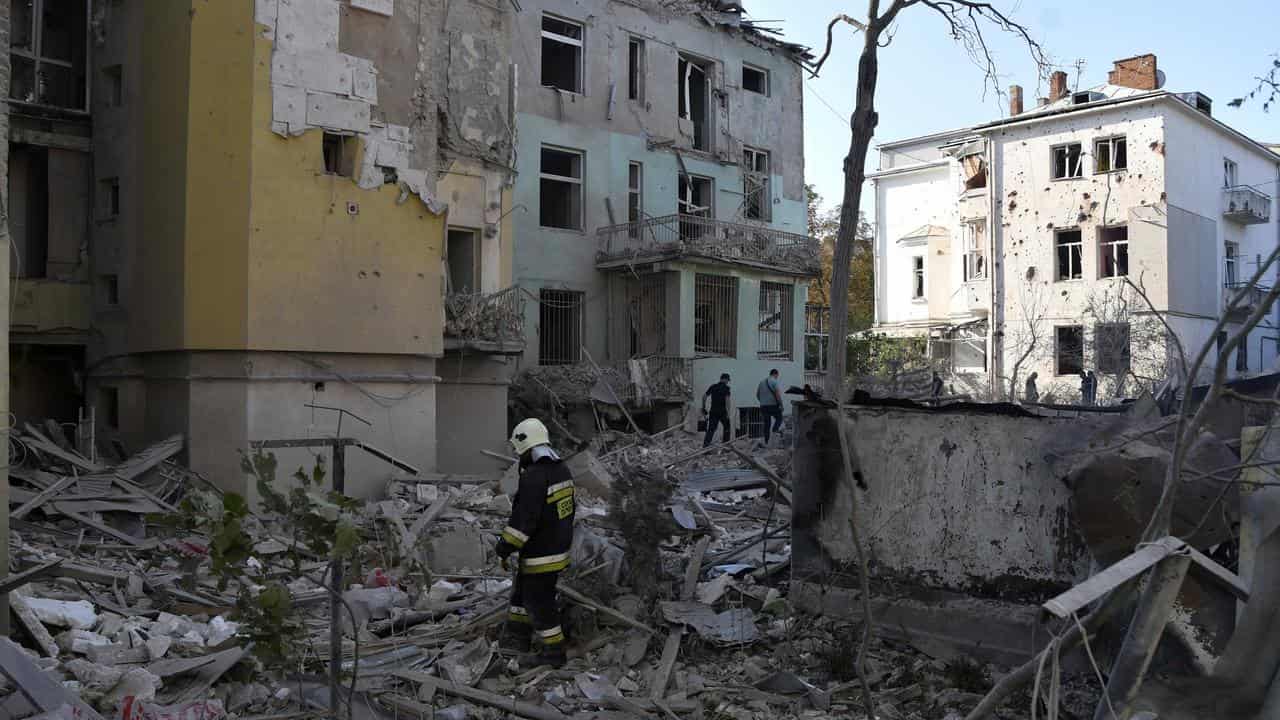 Rescuers search rubble of an apartment building in Lviv