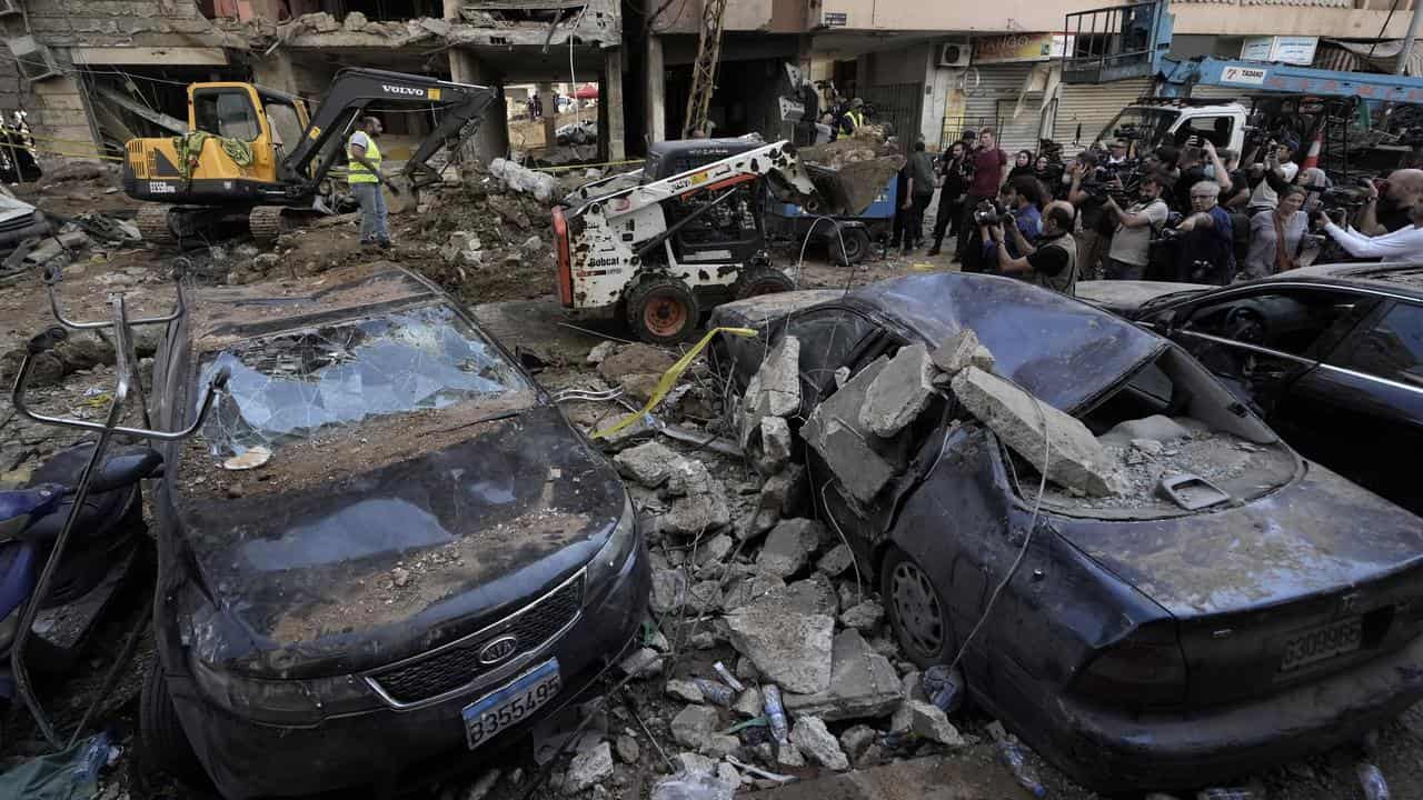 Damaged cars at the missile strike site