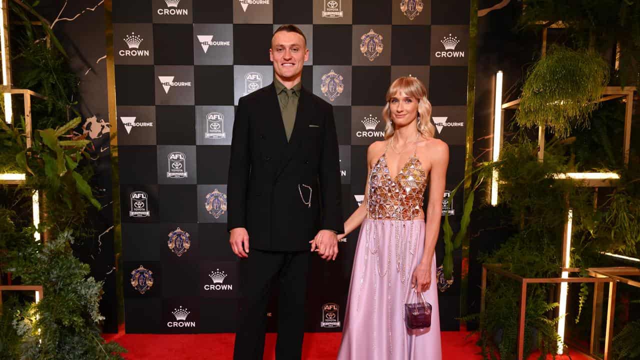 Darcy Moore and Dee Salmin arrive at the Brownlows