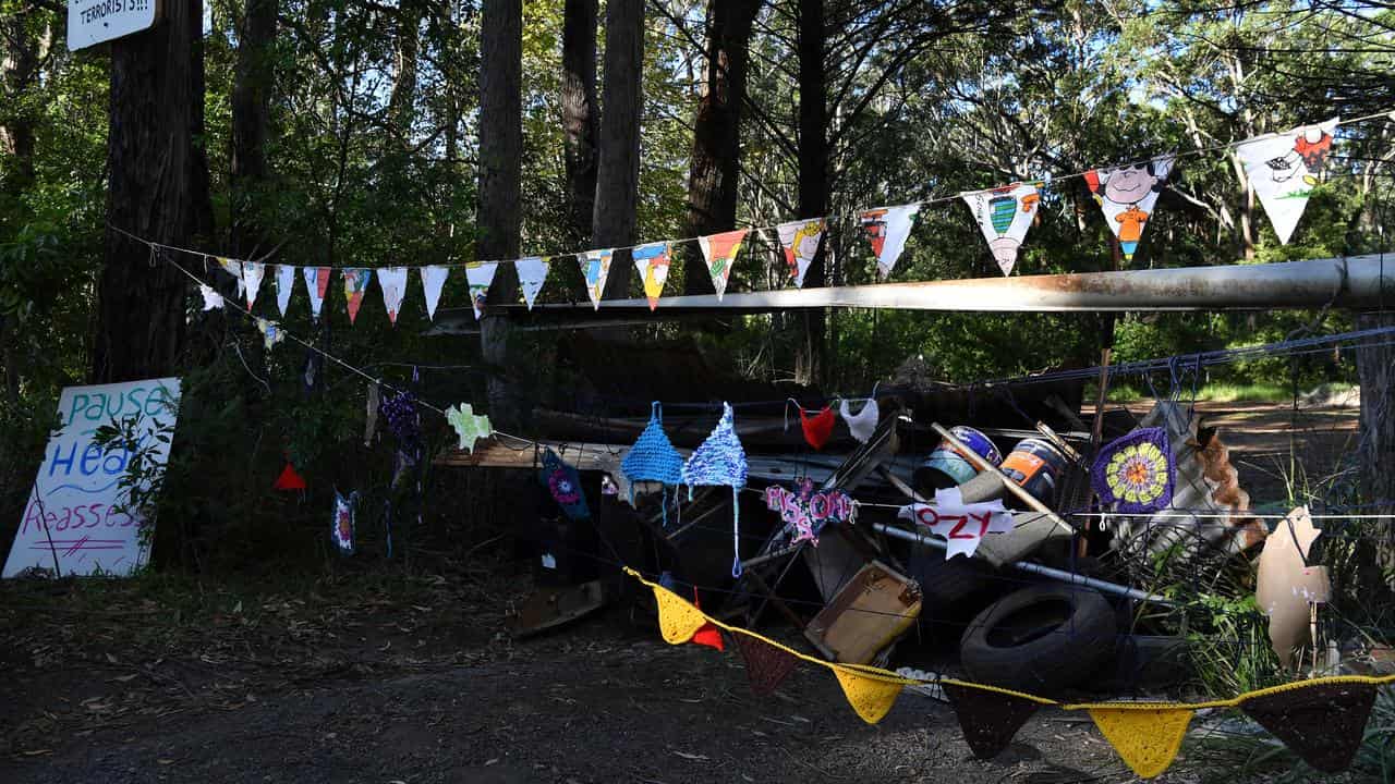 A barricade at the entrance to unburnt bushland at manyana