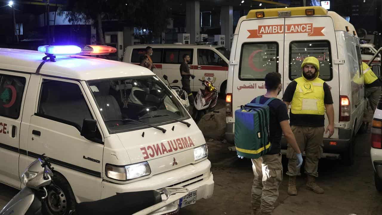 Ambulances evacuate the wounded at the site of an airstrike in Beirut