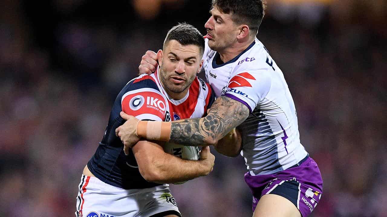 James Tedesco is tackled by Ryan Papenhuyzen.