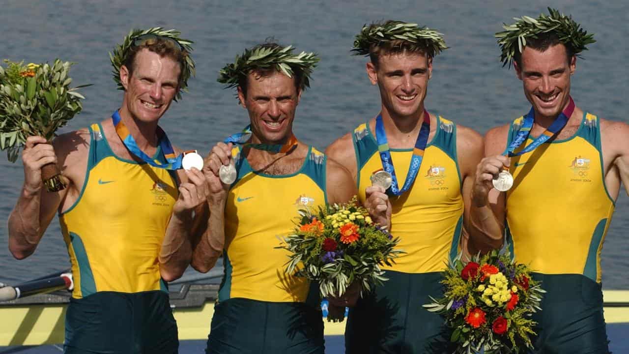 Simon Burgess (2nd left) with silver medal (file image)