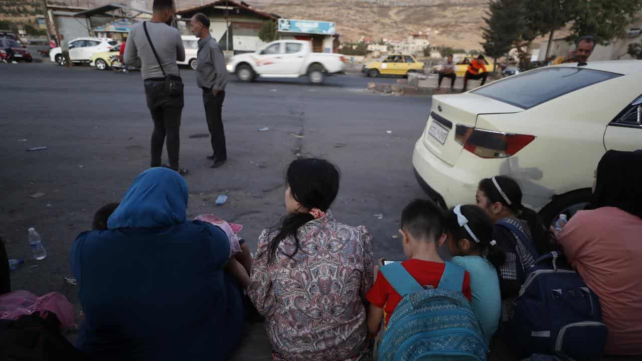 Lebaese people who fled the Israeli bombardment at the Syrian border