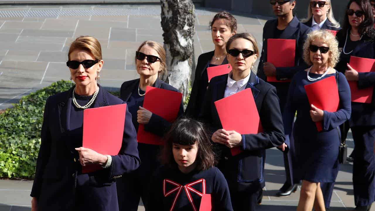 Kirsha Kaechele and other women outside court