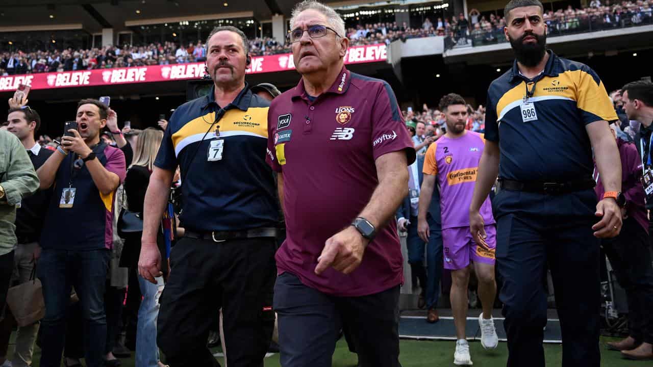 Brisbane Lions coach Chris Fagan (centre).