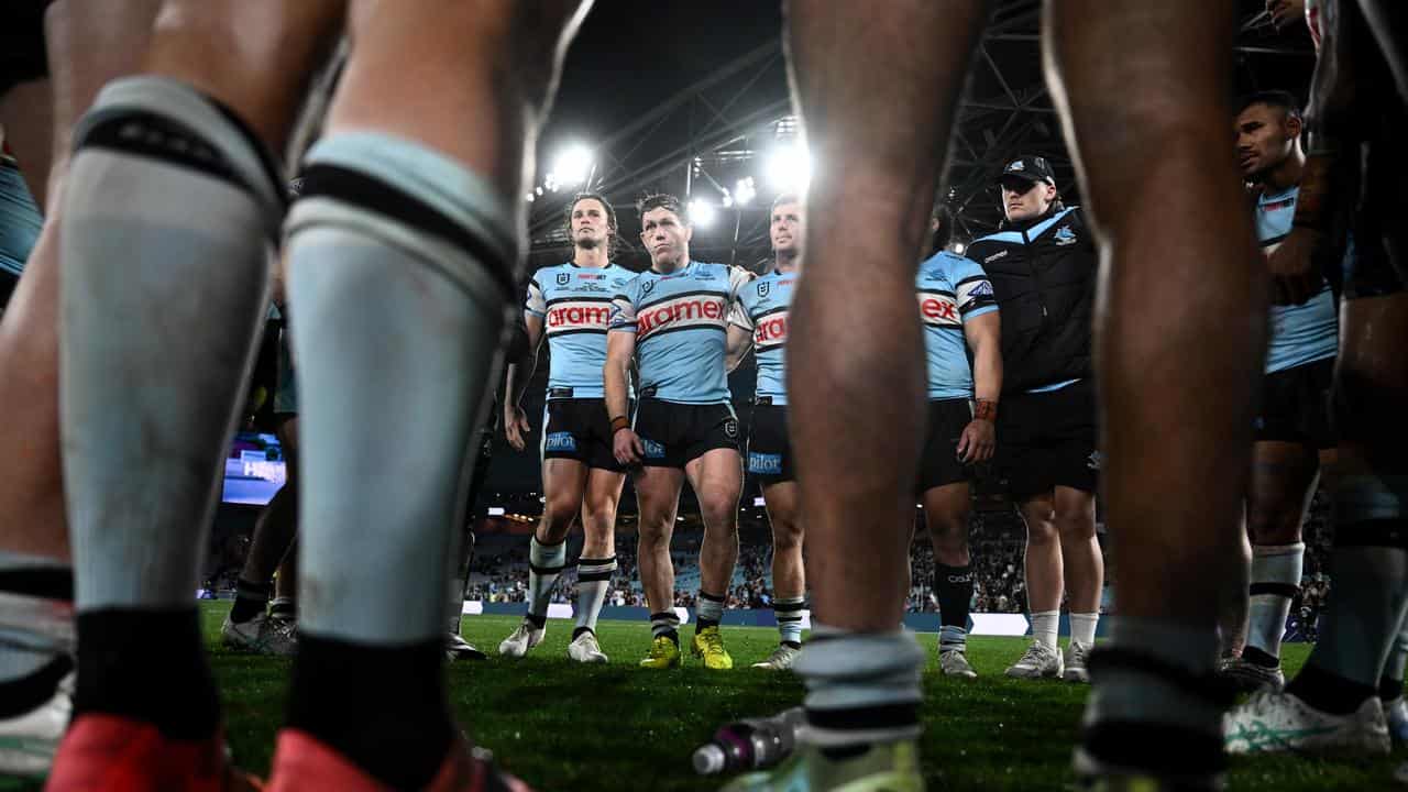 Cronulla players in a huddle.