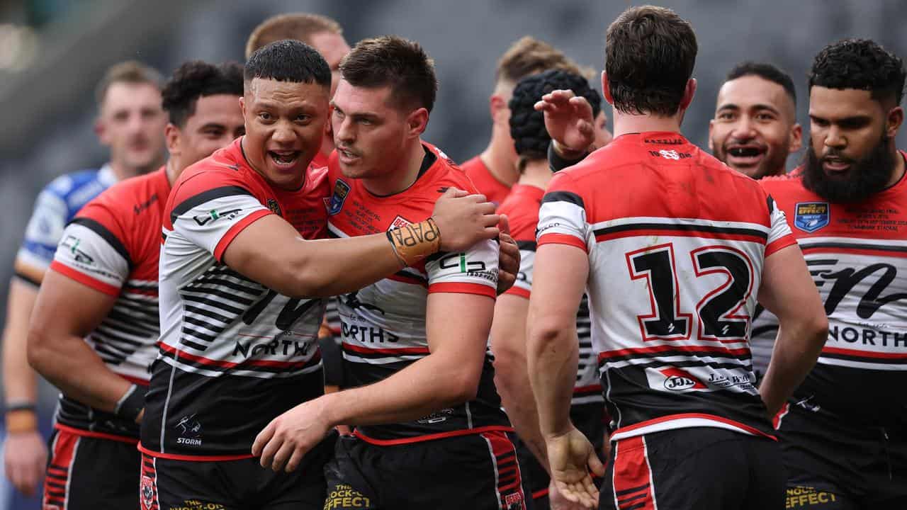 North Sydney Bears celebrate a try to Bronson Garlick.