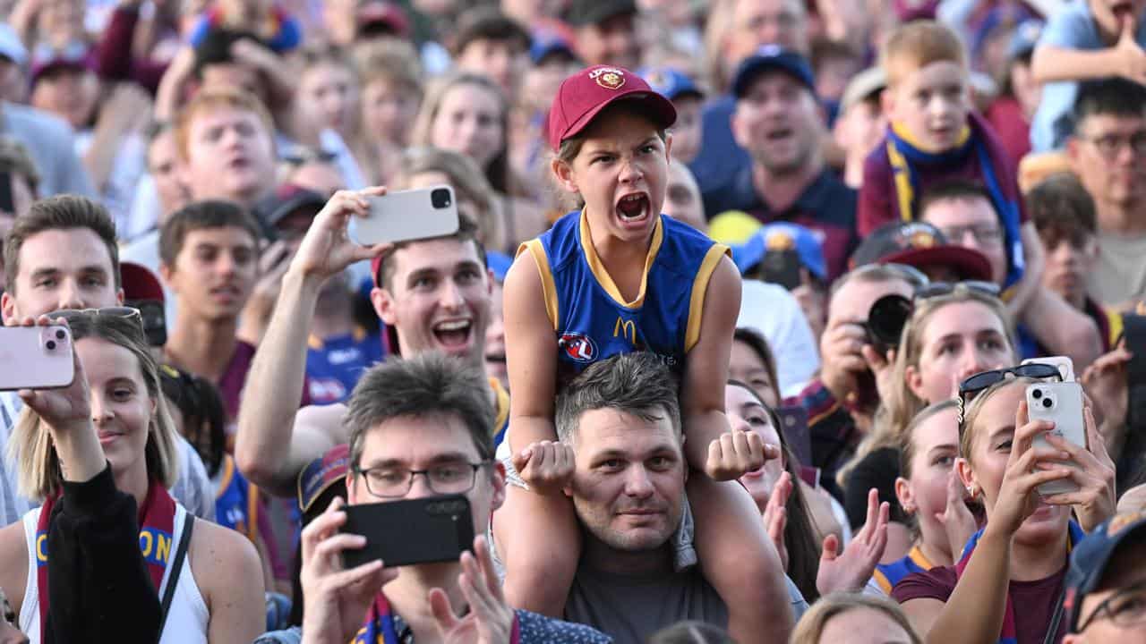 Lions fans are seen cheering.