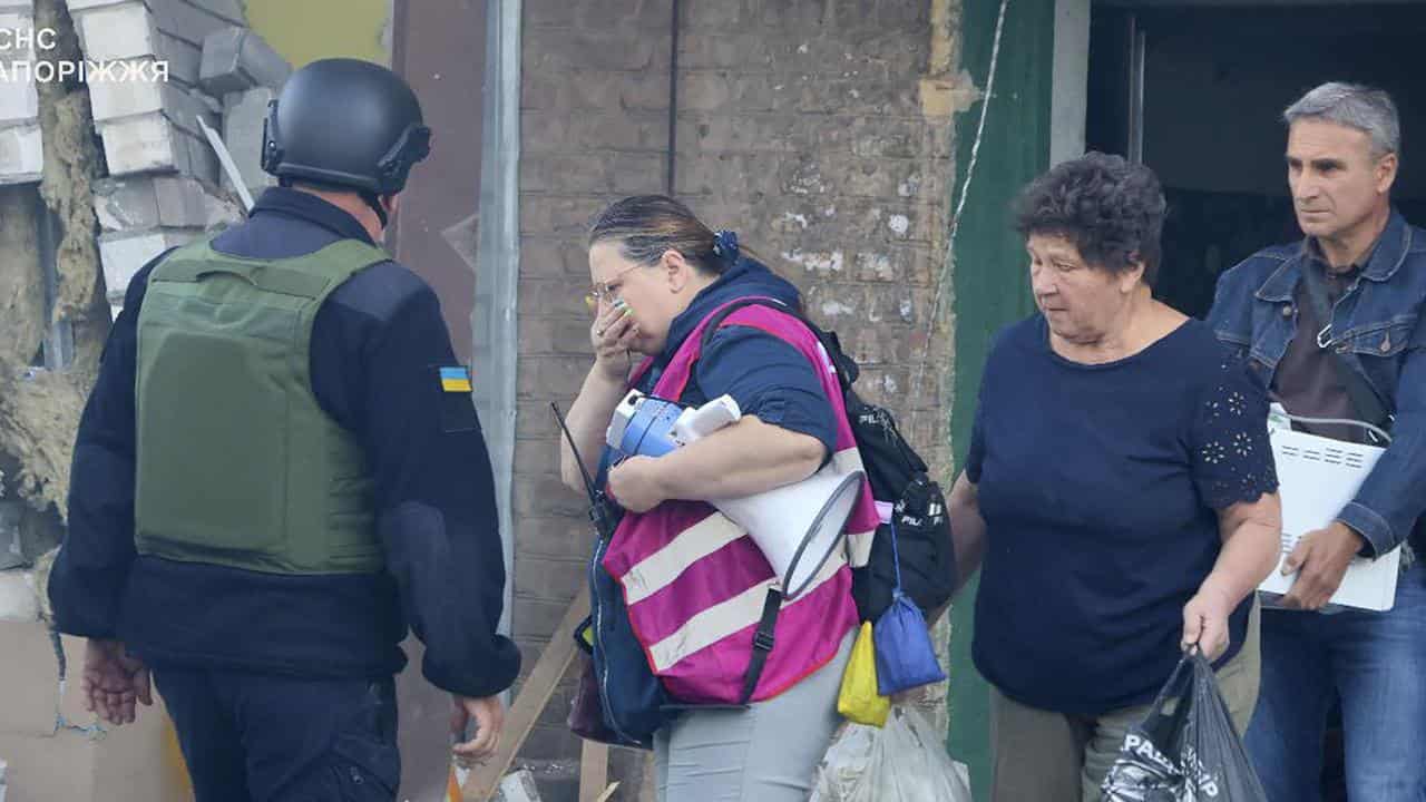 Residents leave their ruined home in Zaporizhzhia, Ukraine