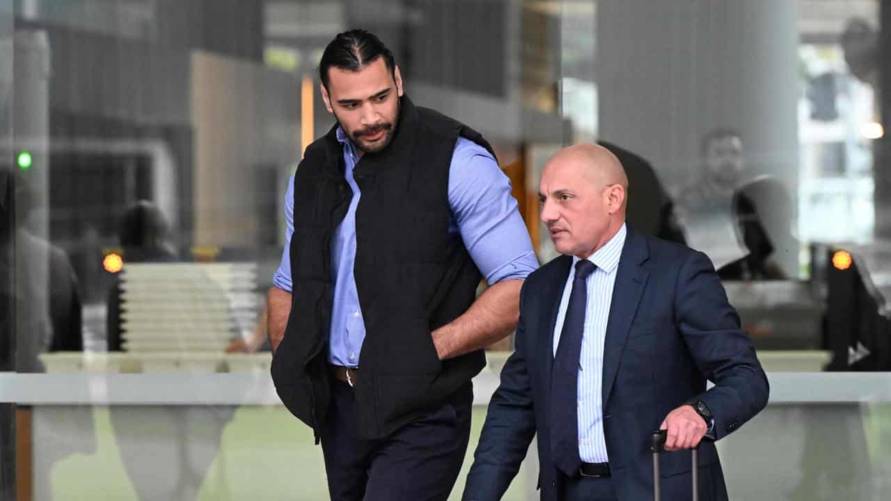 Kayleb Milne (left)  leaving the Brisbane District Court