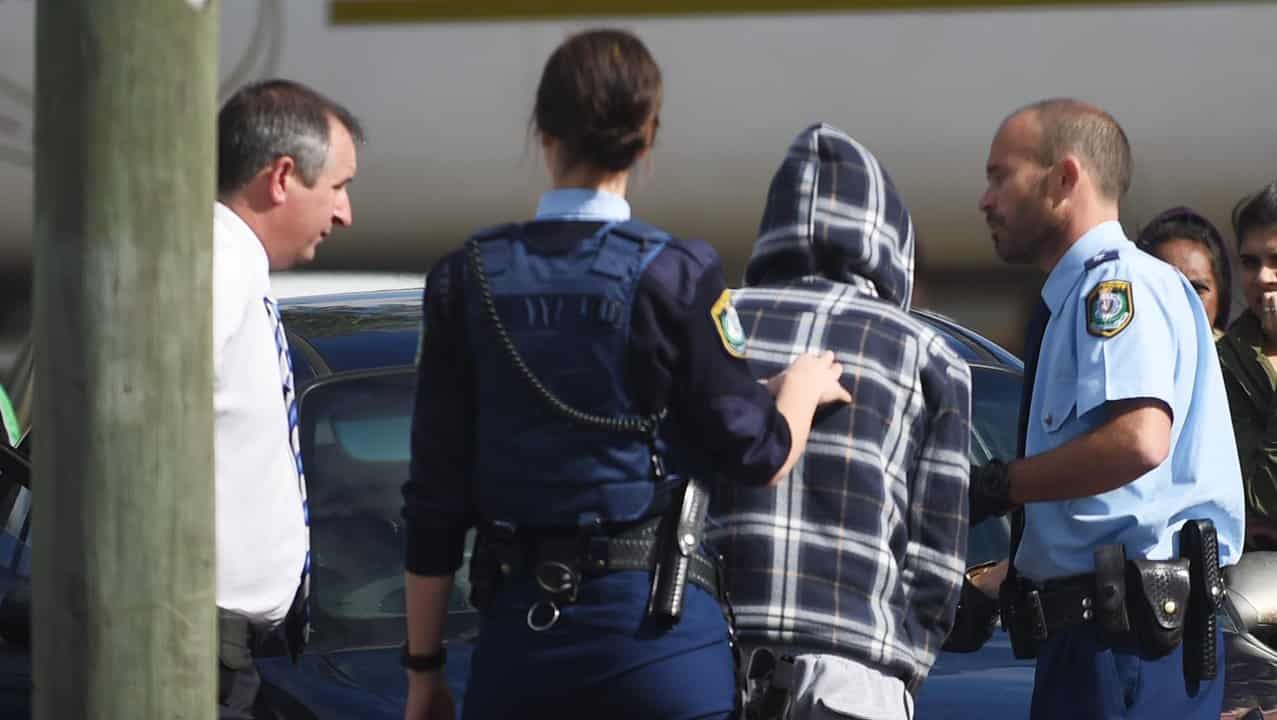 Police question an Aboriginal youth in Bourke (file image)