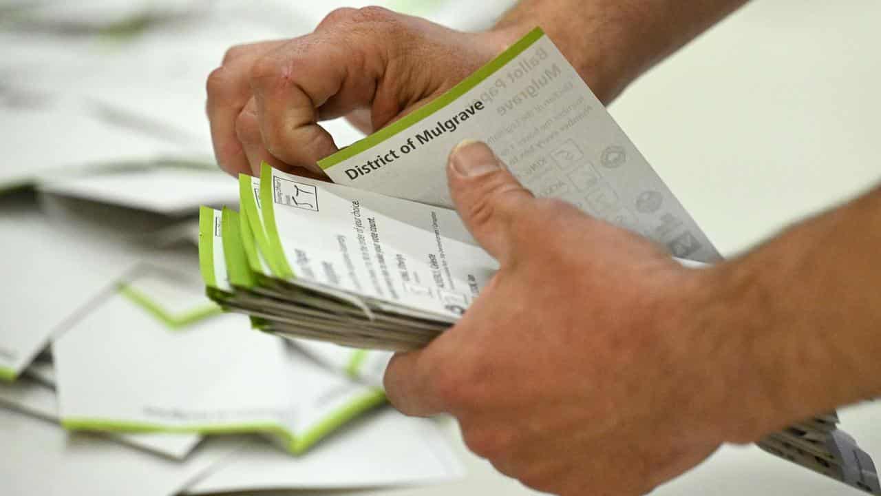 A Victorian Electoral Commission official sorts ballot papers