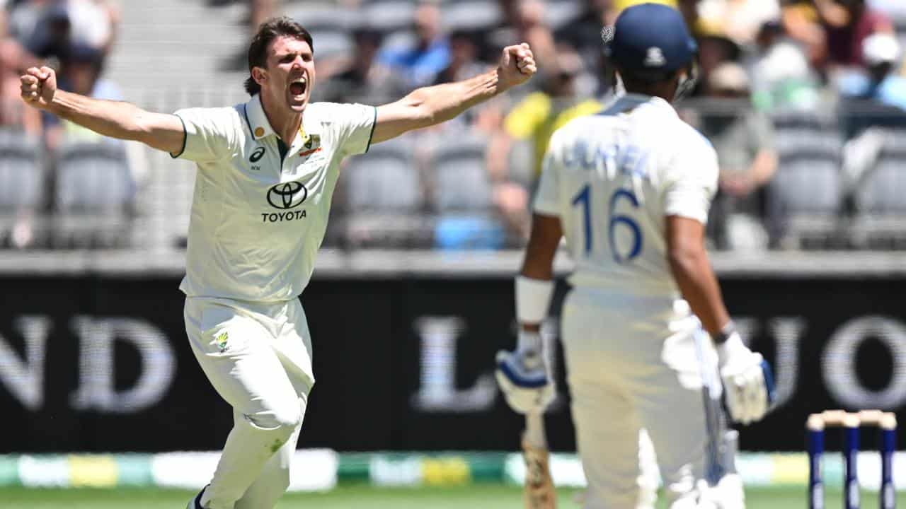 Australia's Mitch Marsh celebrates the wicket of Dhruv Jurel.