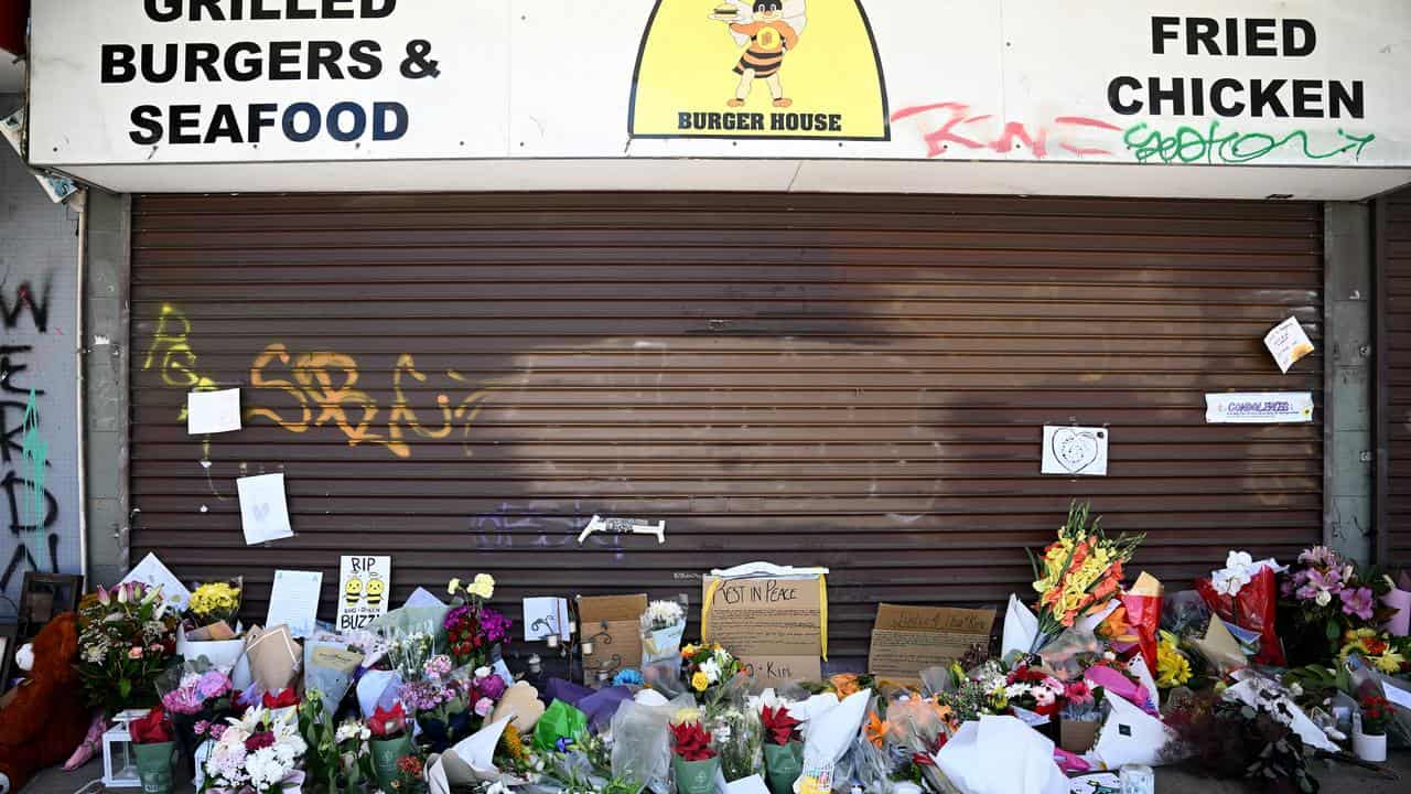 Floral tributes and cards outside Buzzy Bee's in Cambridge Park