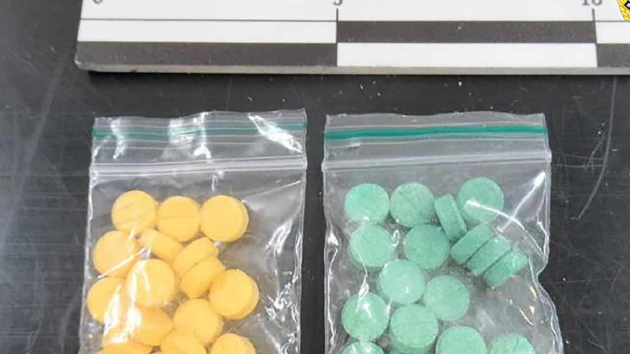 colourful pills divided into small bags.