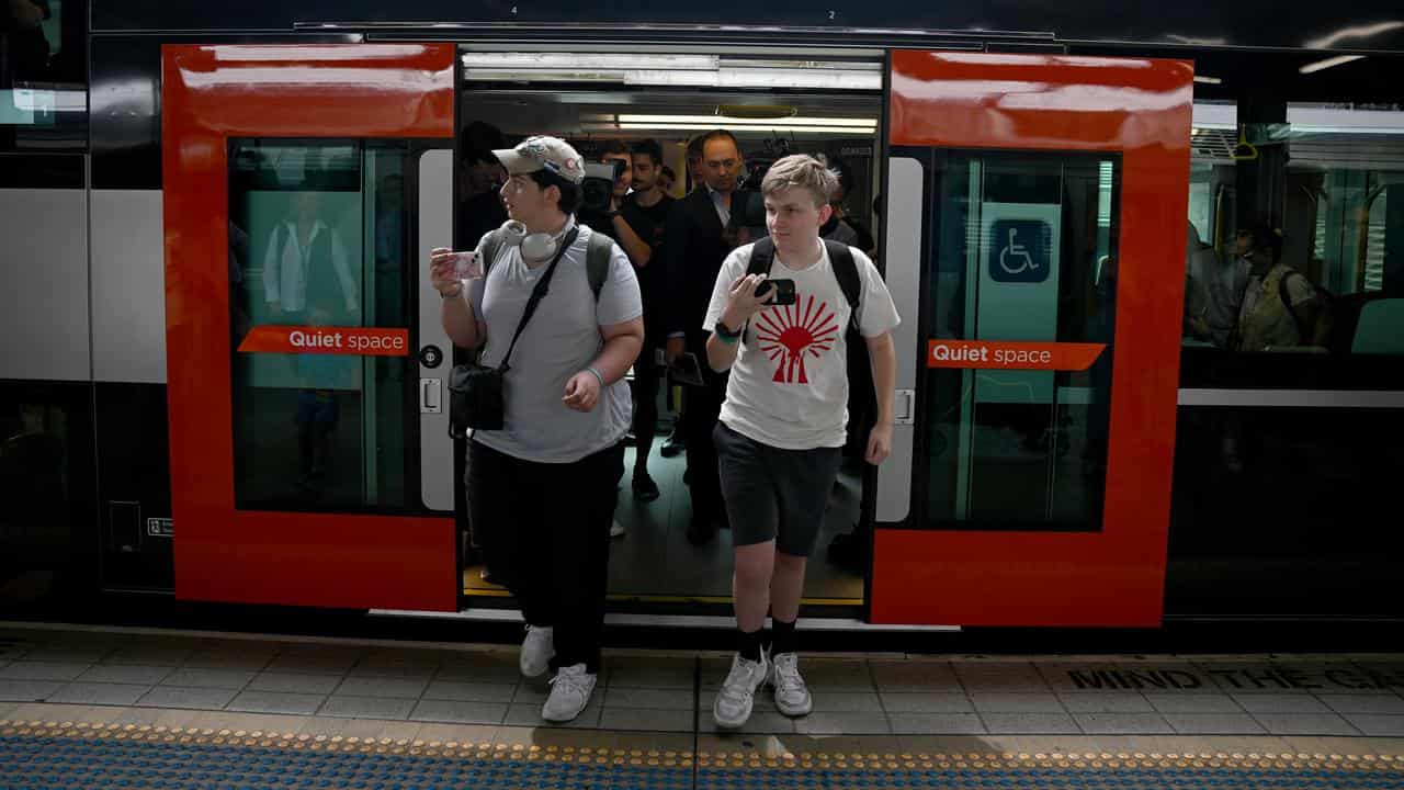 Passengers leave after the maiden trip of the Intercity Mariyung train