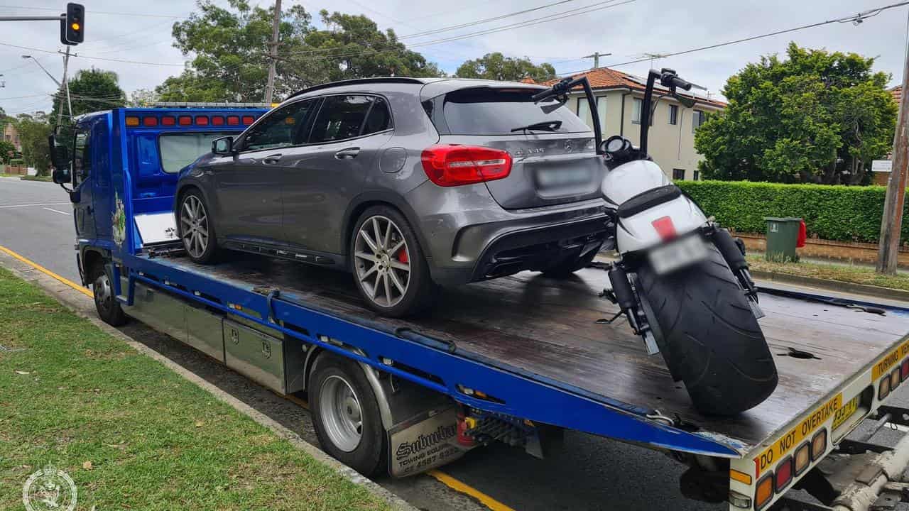 A car and motorbike seized during raids