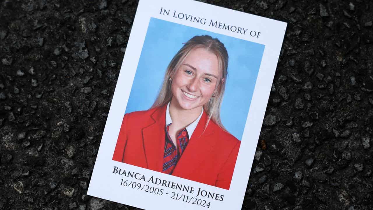 A photograph is seen at the funeral service